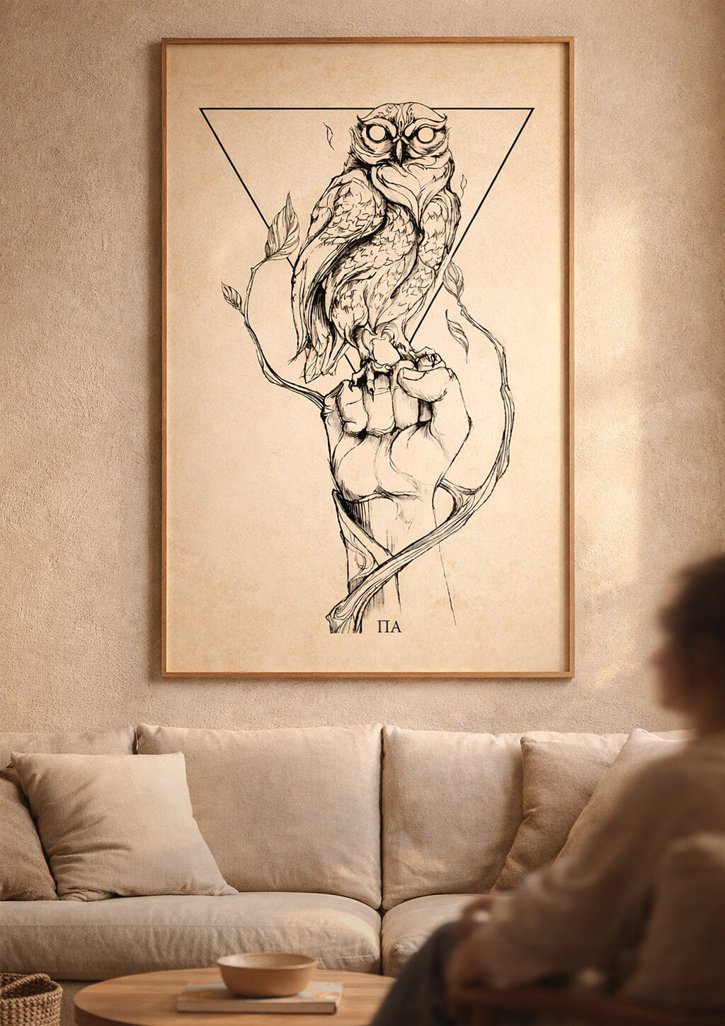 Large owl wall art above sofa, symbolic fine art print representing balance between strength and wisdom in a modern neutral living room